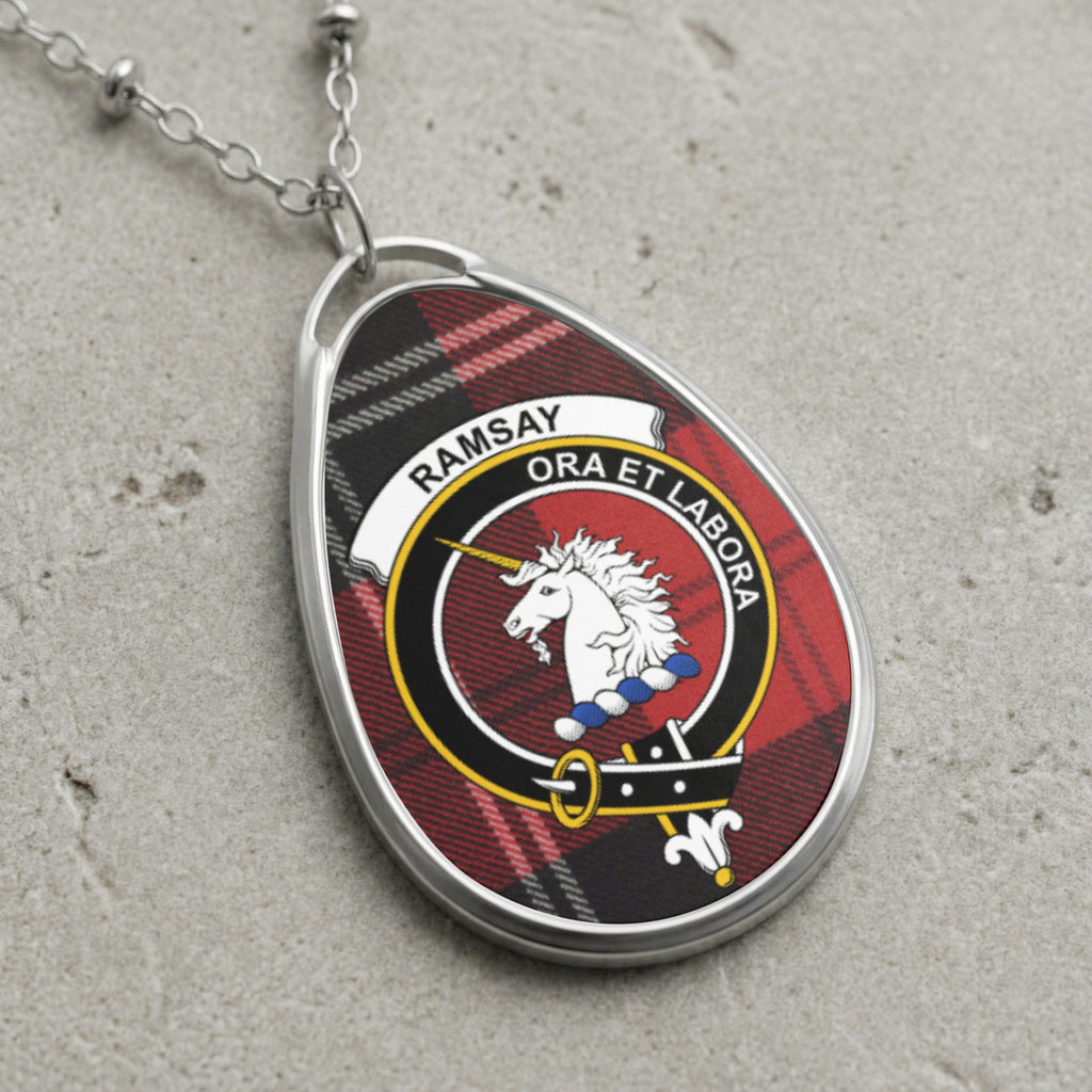Ramsay clan Scottish tartan necklace with clan crest and Ora Et Labora motto on tartan background