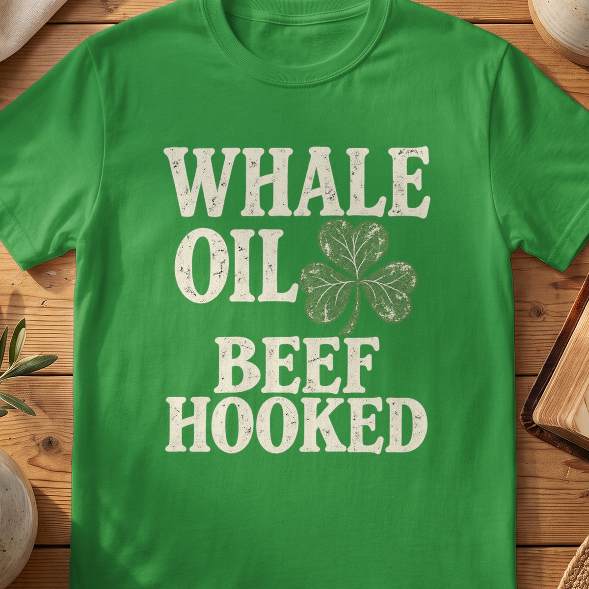 Green St Patrick's Day T-shirt featuring “Whale Oil Beef Hooked” and a shamrock graphic.