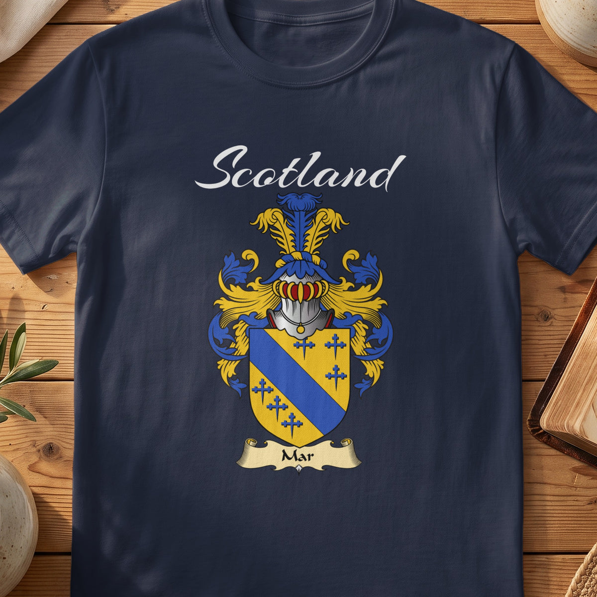 Navy Mar family shield T-shirt featuring a gold shield crossed by a blue diagonal band