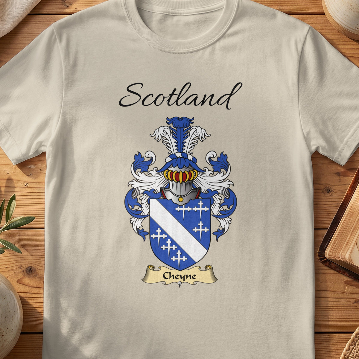 Sand Cheyne Scottish family shield T-shirt featuring a white diagonal band and small crosses on blue