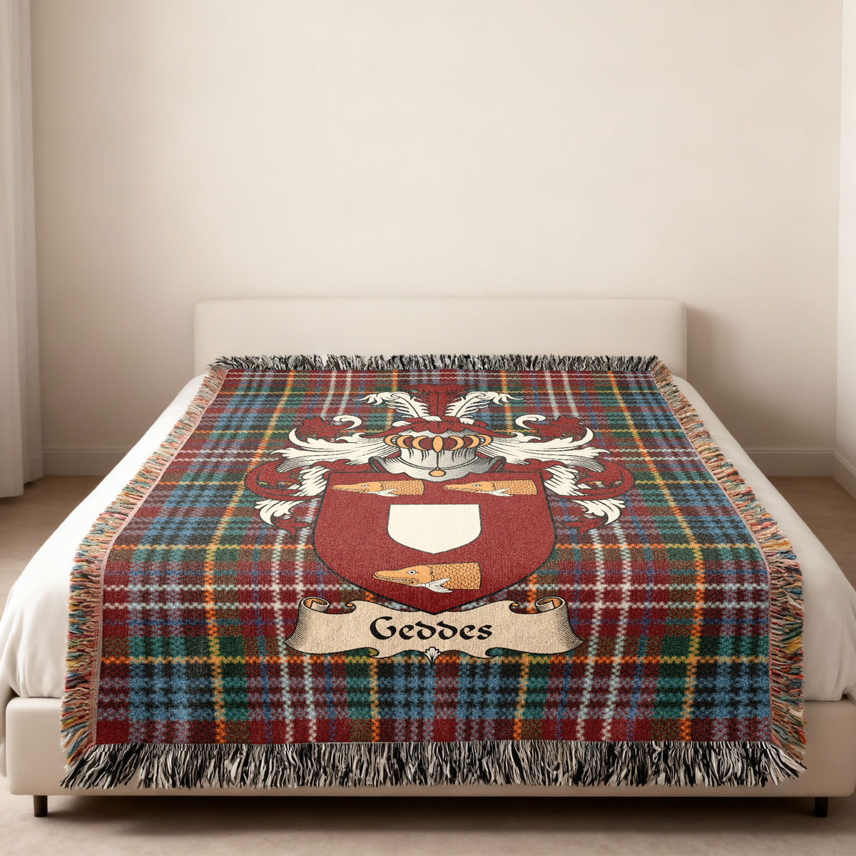 Geddes Scottish family shield woven blanket on a Caledonia tartan background