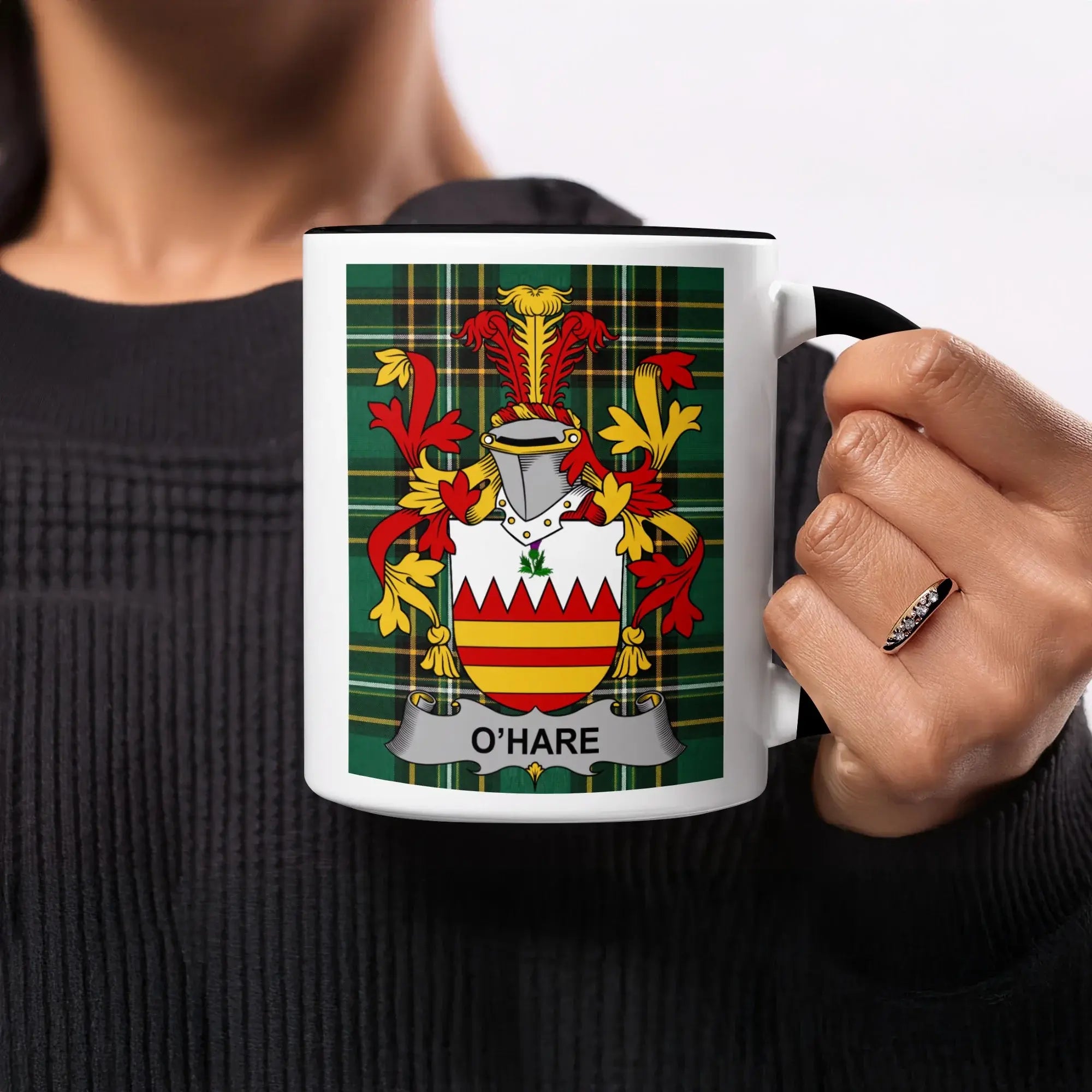 Mug with O'Hare family crest on plaid background.