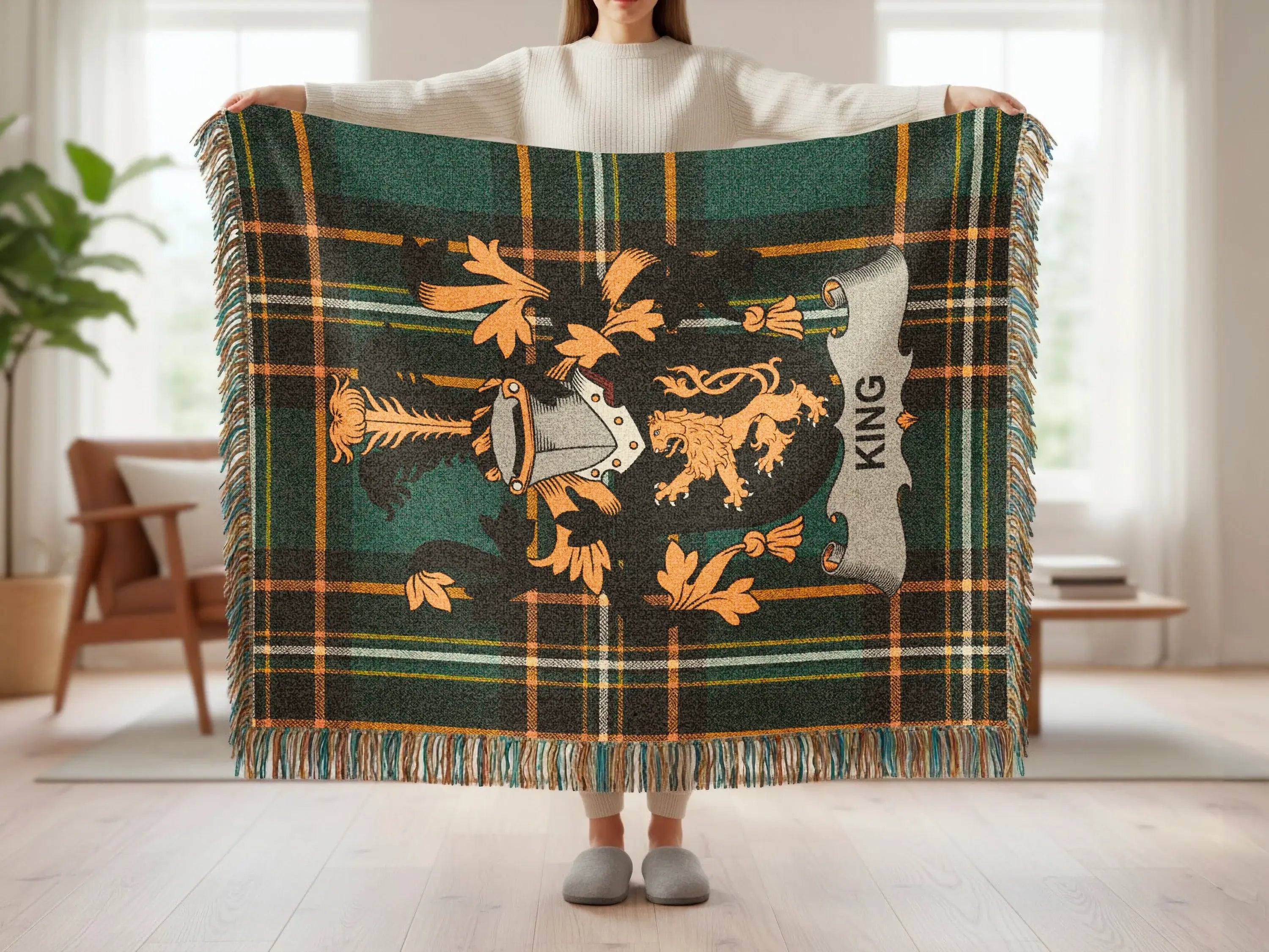 Tartan blanket with lion rampant crest and "KING" banner.