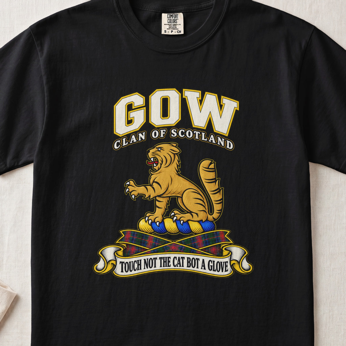 Gow Scottish clan T-shirt in Black, front view with a golden wildcat and motto design.