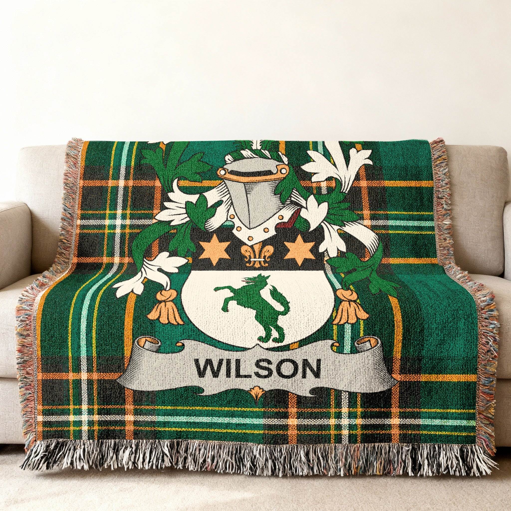 Green plaid woven throw blanket with Wilson family crest.