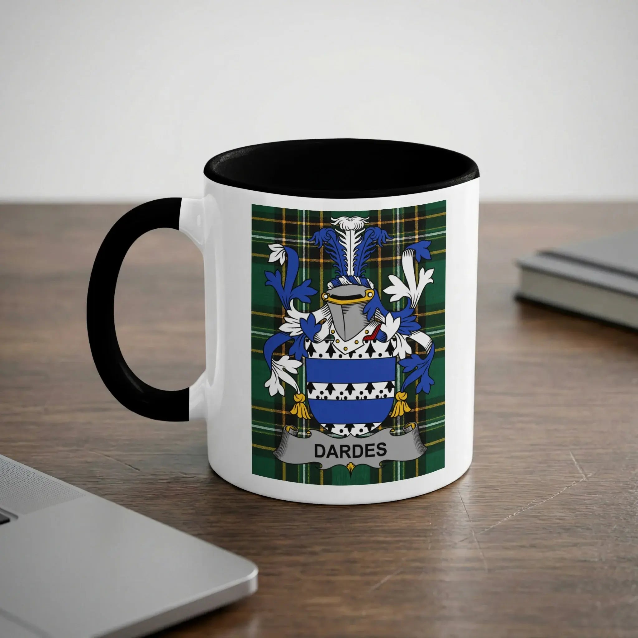 White mug with black rim featuring the DARDES family crest in blue, green, and white.