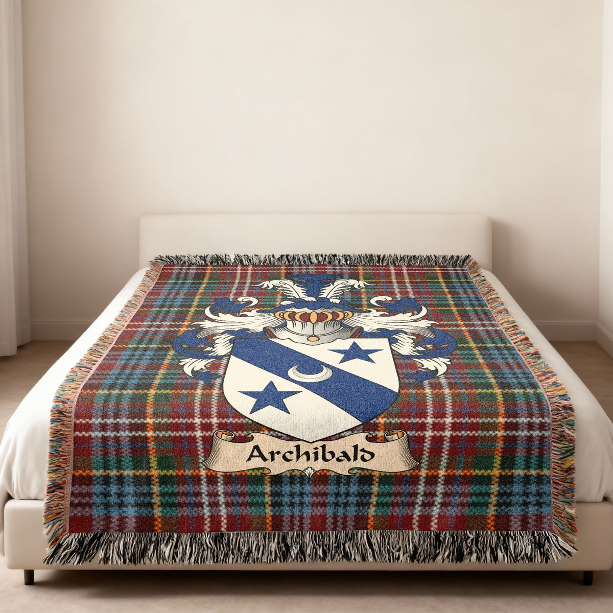 Archibald family crest emblem on a Caledonia tartan woven blanket