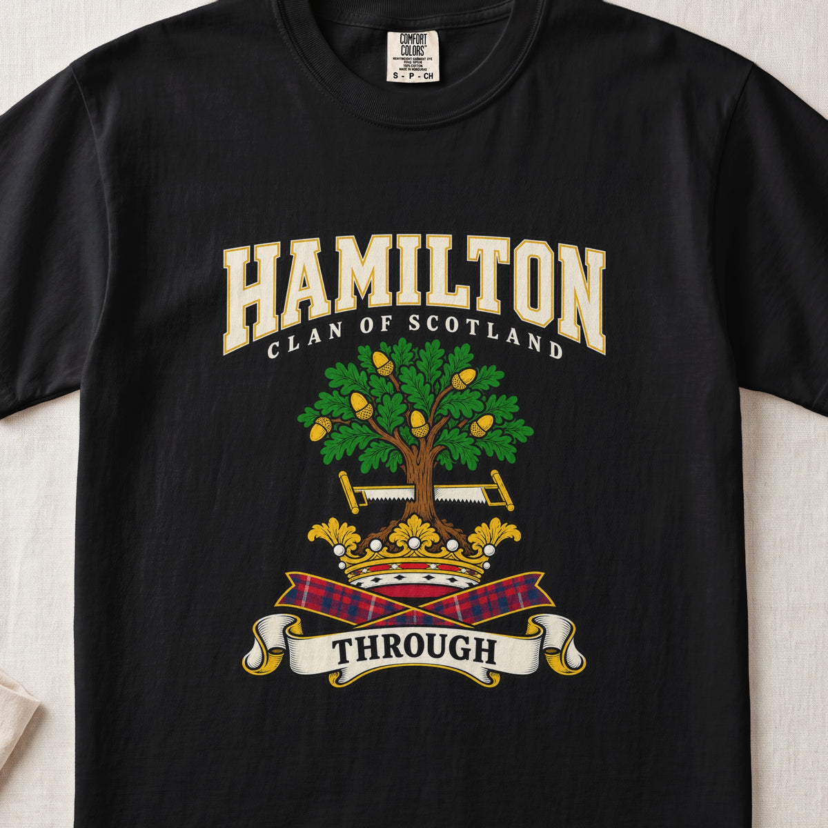Hamilton graphic T-shirt in Black, front flat lay showing varsity lettering and green oak-like tree with gold acorns.
