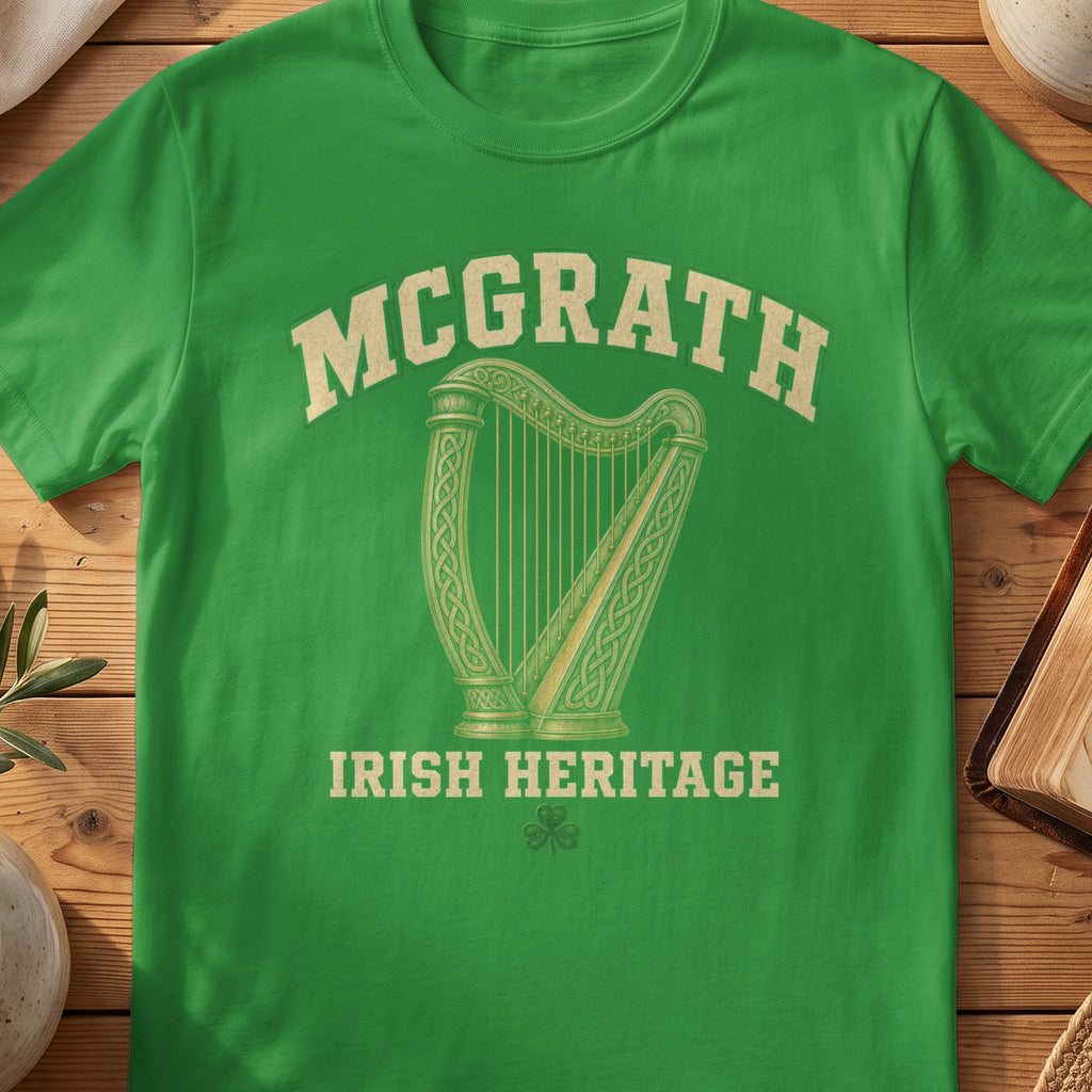 McGrath Irish harp T-shirt in Irish Green, with cream surname lettering, a gold-toned harp, green shamrock and “Irish Heritage” text.