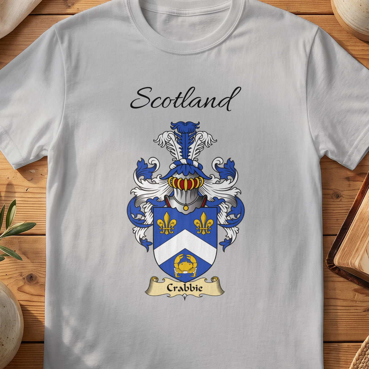 Sport Grey Crabbie Scottish family shield T-shirt featuring a white chevron and gold motifs on blue