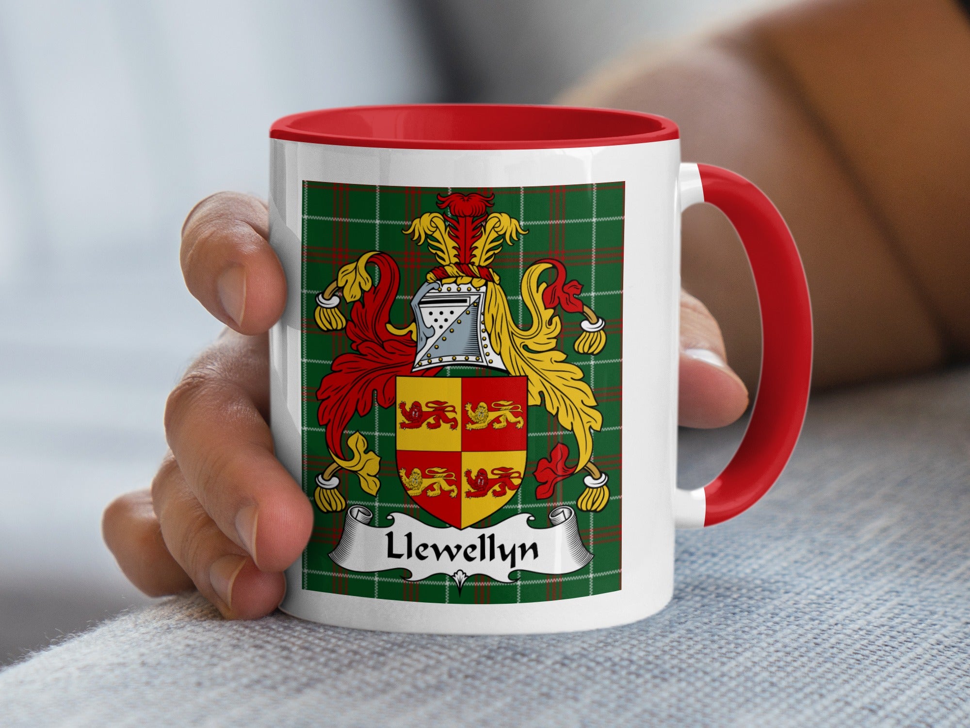 Llewellyn Welsh tartan accent mug with red handle and coat of arms held in hand