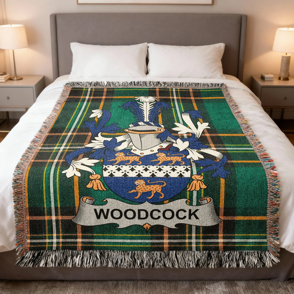 Tartan blanket with Woodcock family crest featuring lions.