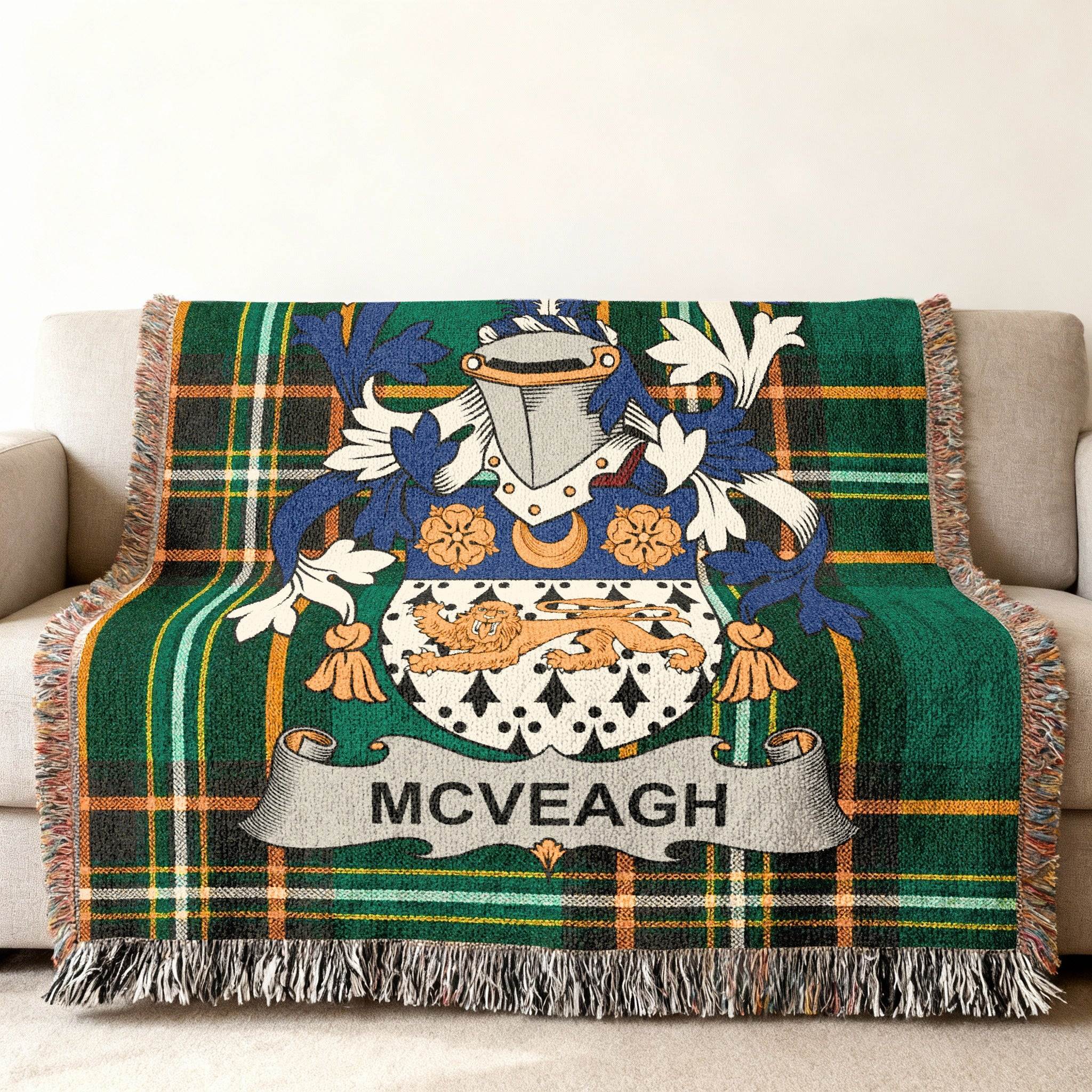 McVeagh coat of arms on a green plaid woven blanket draped on a sofa.