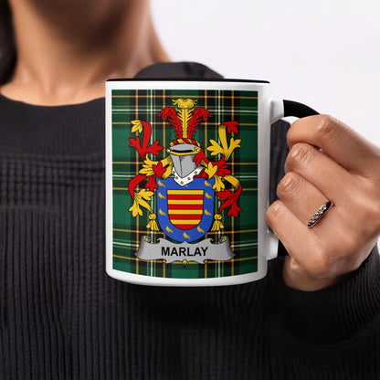 Mug with Marlay coat of arms on green plaid background.