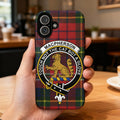 Clan MacPherson tartan phone case — glossy full-wrap print with cat crest on iPhone