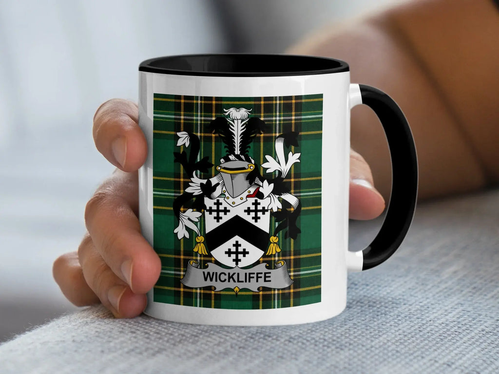 White mug with black handle featuring Wickliffe family crest on tartan background.