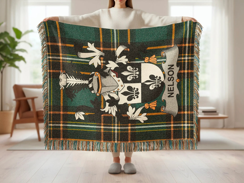 Tartan blanket with a shield crest and "Nelson" text.