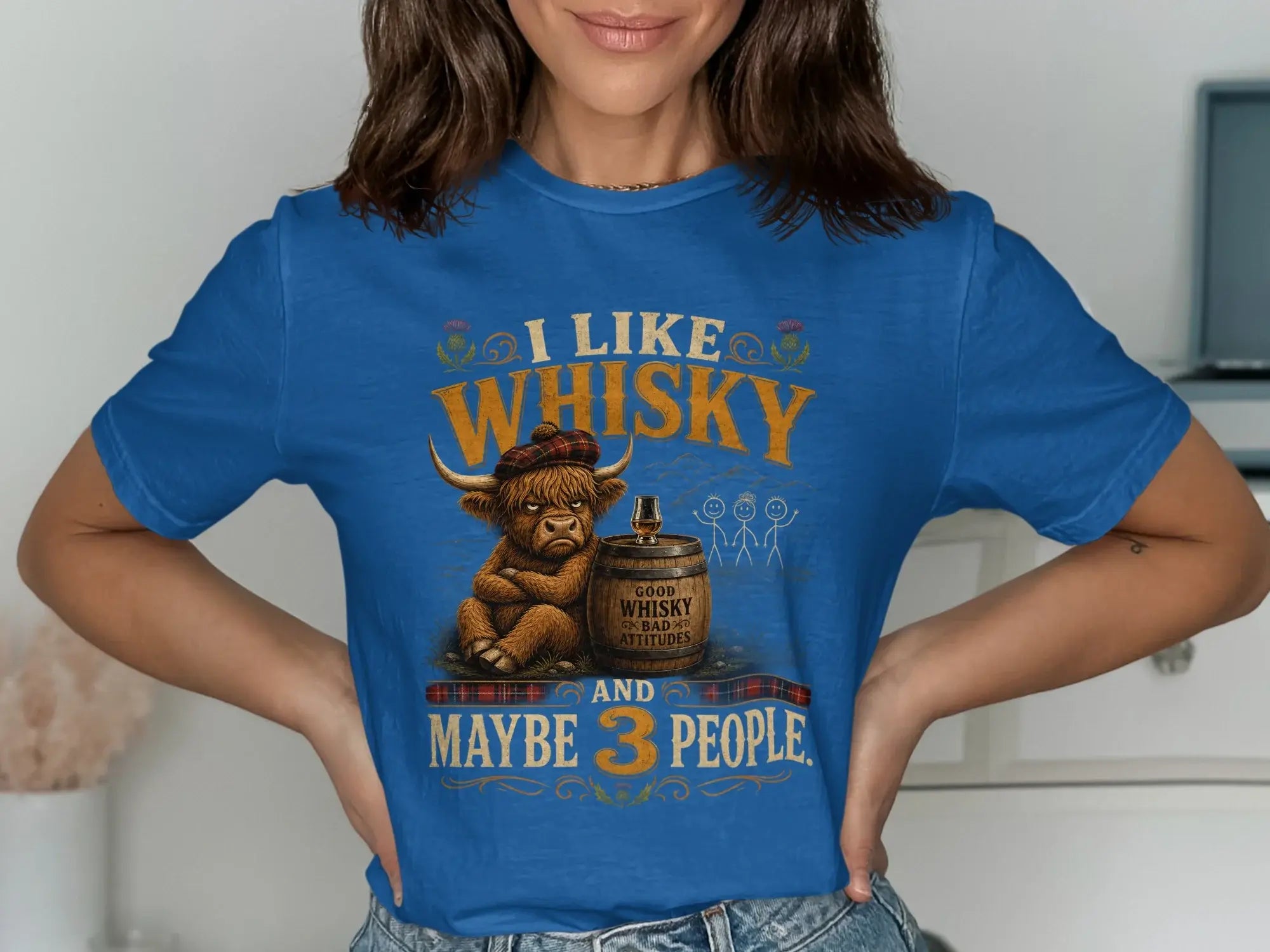 Blue t-shirt with "I like whisky and maybe 3 people" and a grumpy Highland cow graphic.