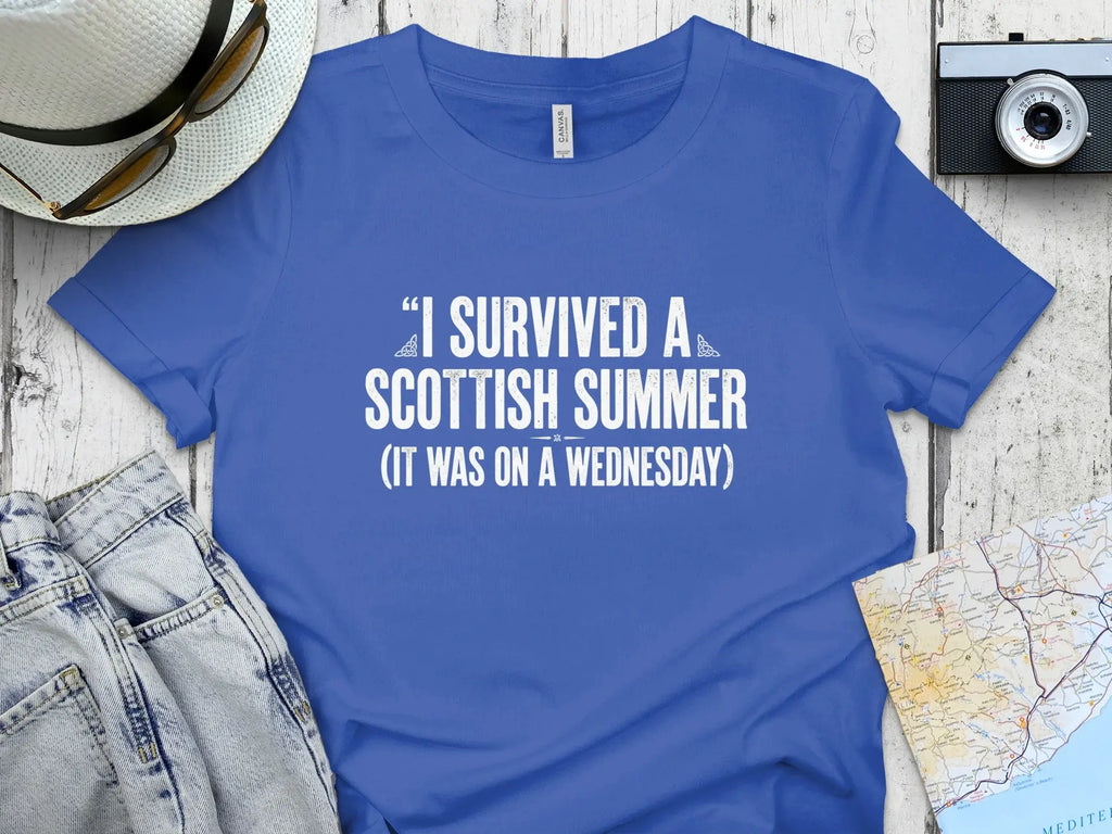 Blue t-shirt with white text "I survived a Scottish summer (it was on a Wednesday)".