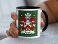 White mug with black handle displaying Lewis family crest on green tartan background.