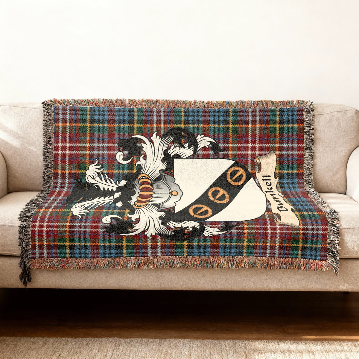 Size guide for Bunkell Scottish family shield woven blanket on a Caledonia tartan background