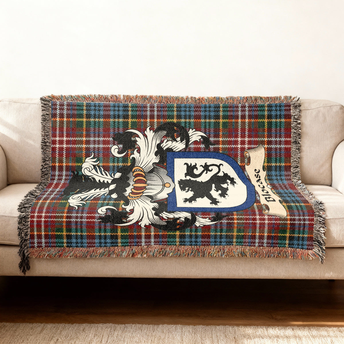Blocase Scottish woven blanket with family shield and Caledonia tartan background