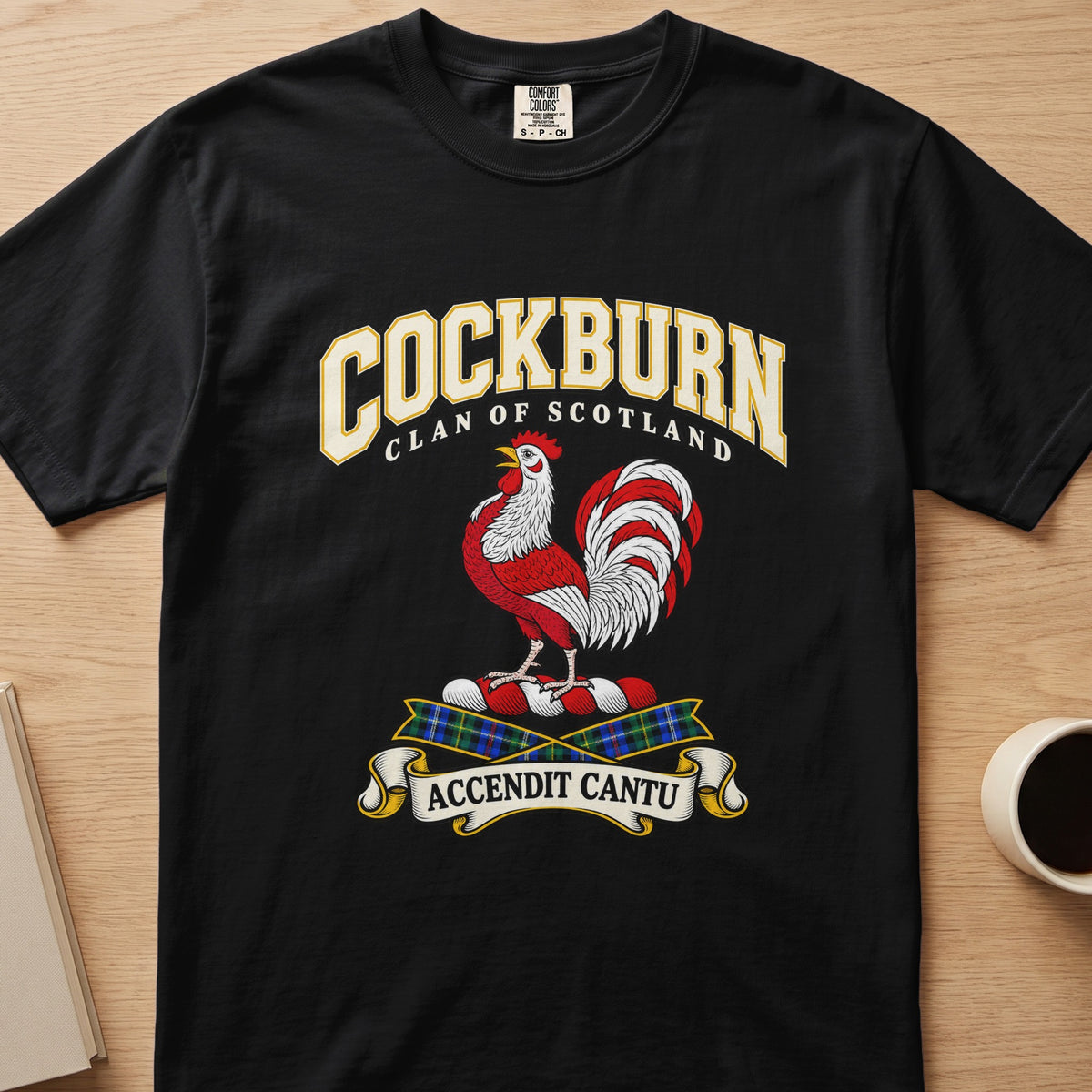 Cockburn red-and-white rooster crest graphic on a black Comfort Colors T-shirt, front view
