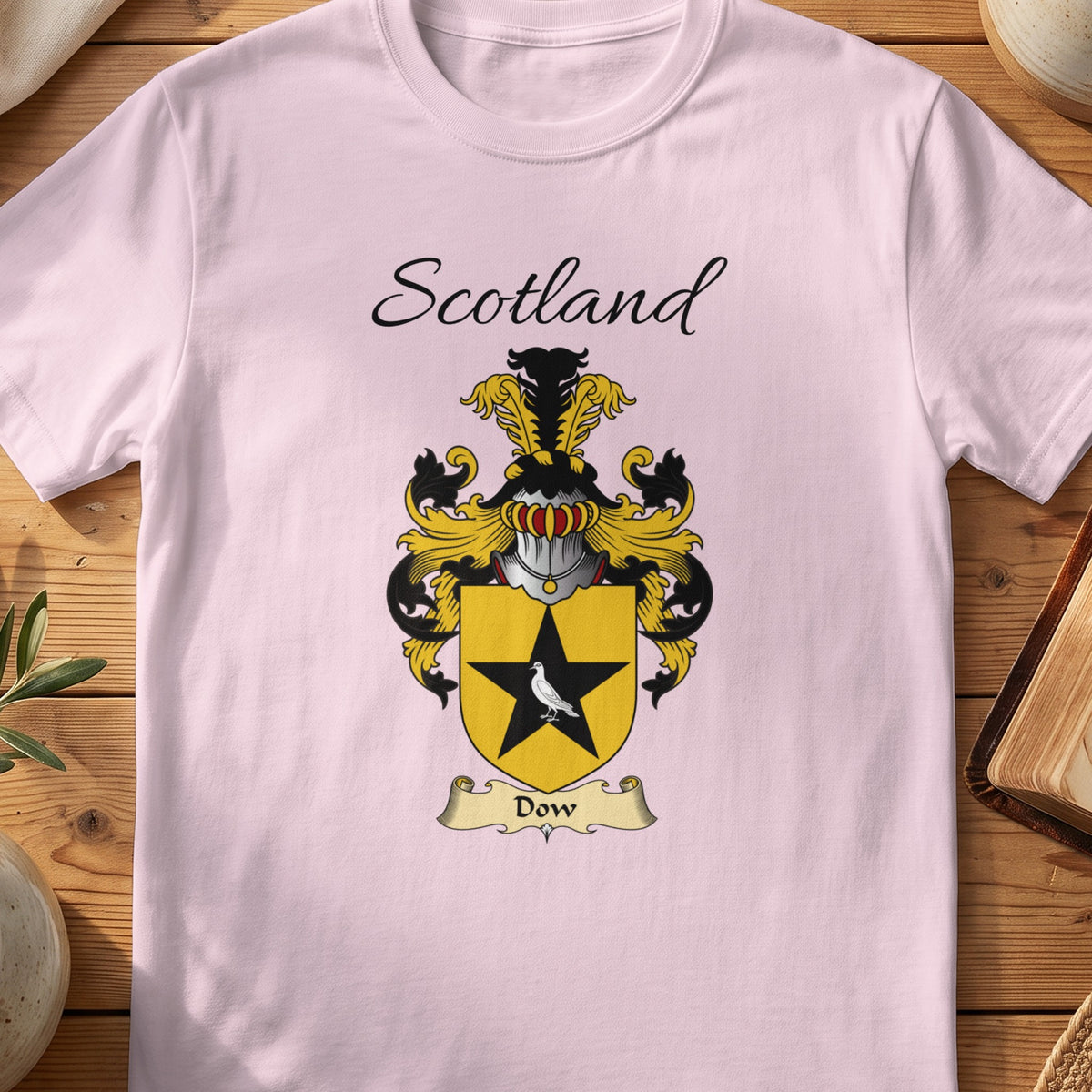 Light Pink Dow Scottish family shield T-shirt featuring a black star on a gold shield