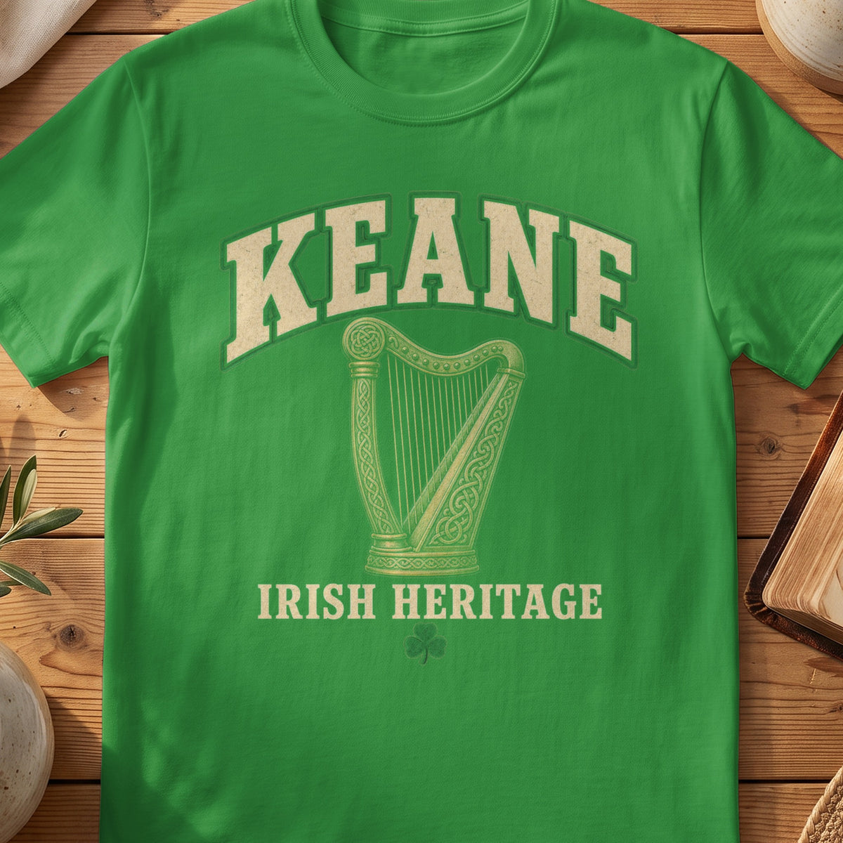 Keane Irish harp T-shirt in Irish Green, with cream surname lettering, a gold-toned harp, green shamrock and “Irish Heritage” text.