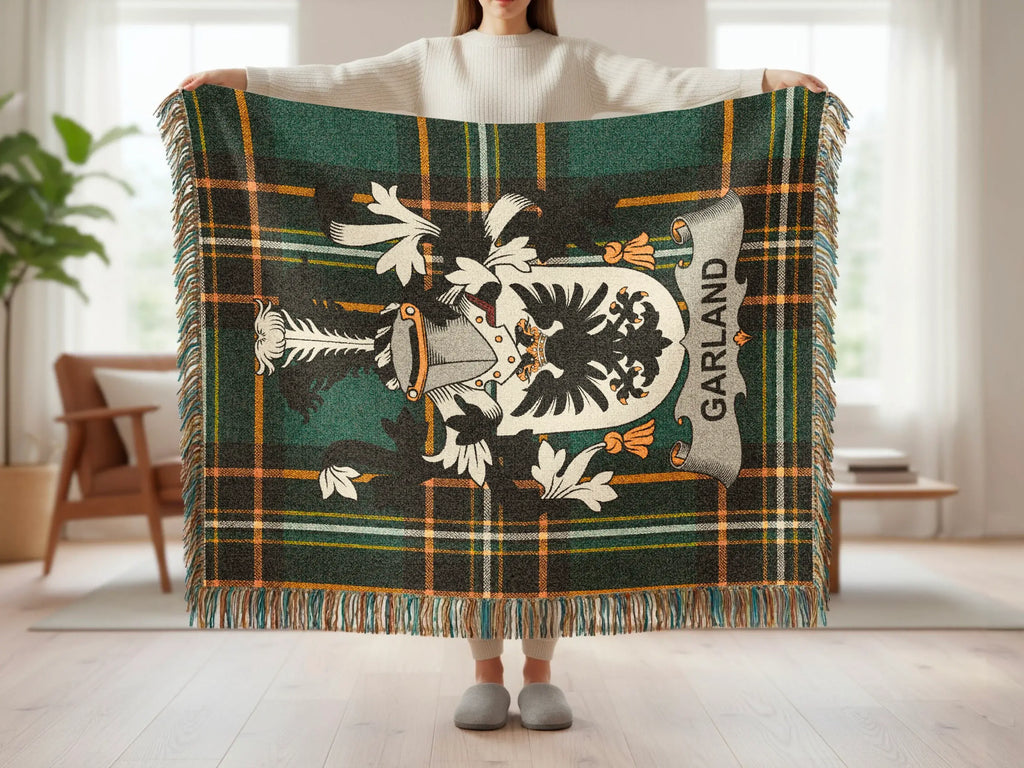 Tartan blanket with a black eagle crest and "Garland" text.