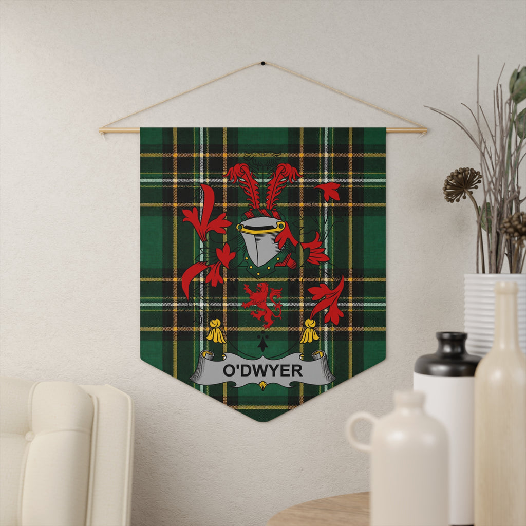 O'Dwyer family crest banner on green tartan fabric hanging on wall.