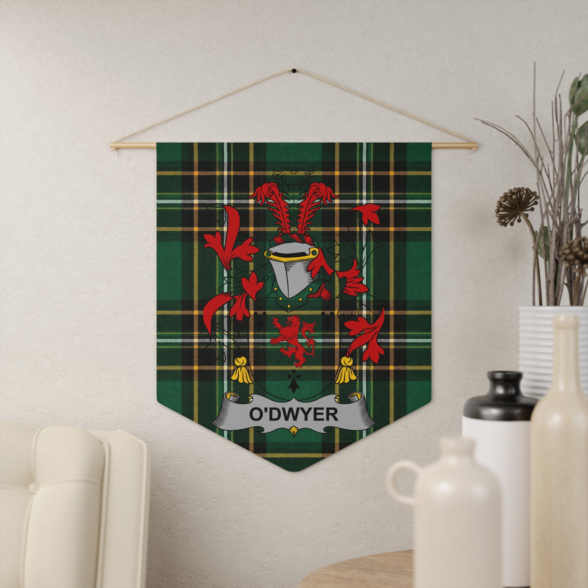 O'Dwyer family crest banner on green tartan fabric hanging on wall.