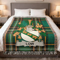 Green plaid blanket with a family crest featuring the name "LOW".