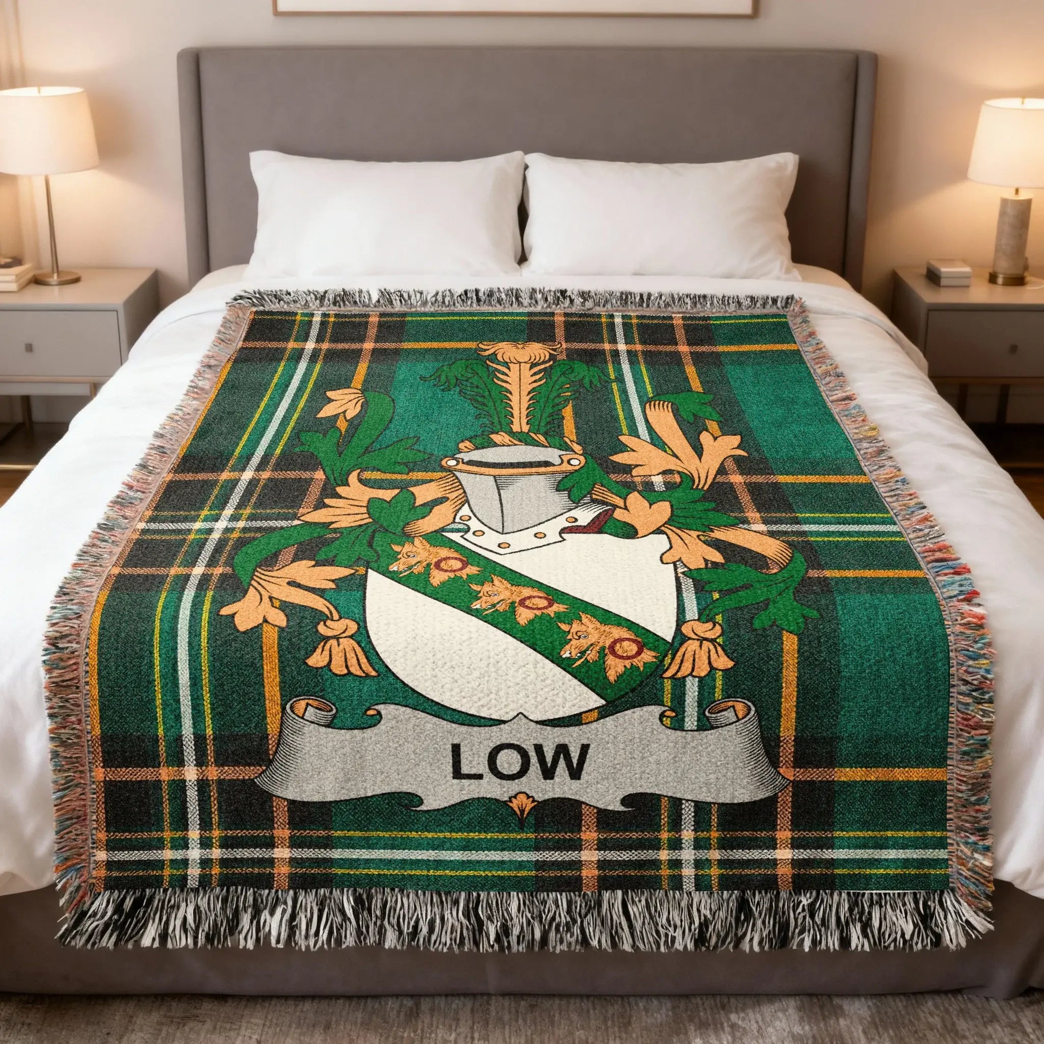 Green plaid blanket with a family crest featuring the name "LOW".
