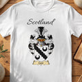 White Cant Scottish family shield T-shirt featuring a black scalloped diagonal band between black crescents