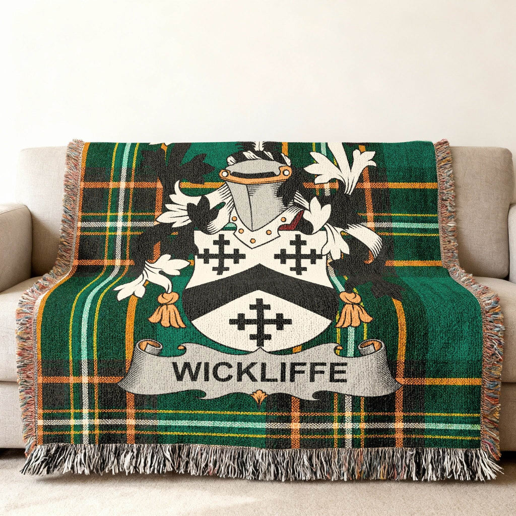 Wickliffe family crest on a green and black plaid throw blanket.