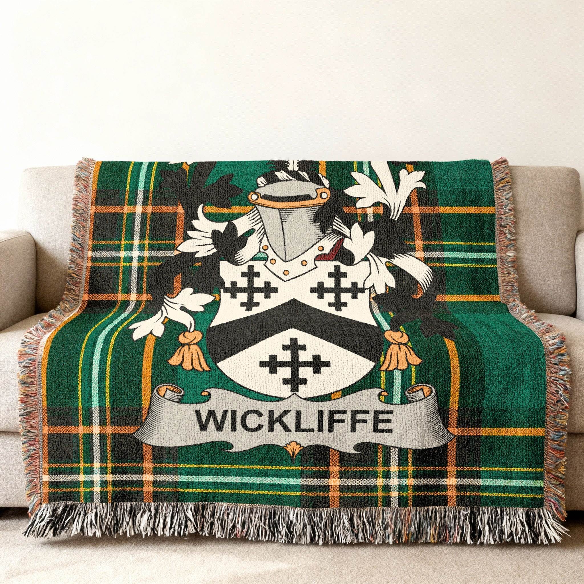 Wickliffe family crest on a green and black plaid throw blanket.