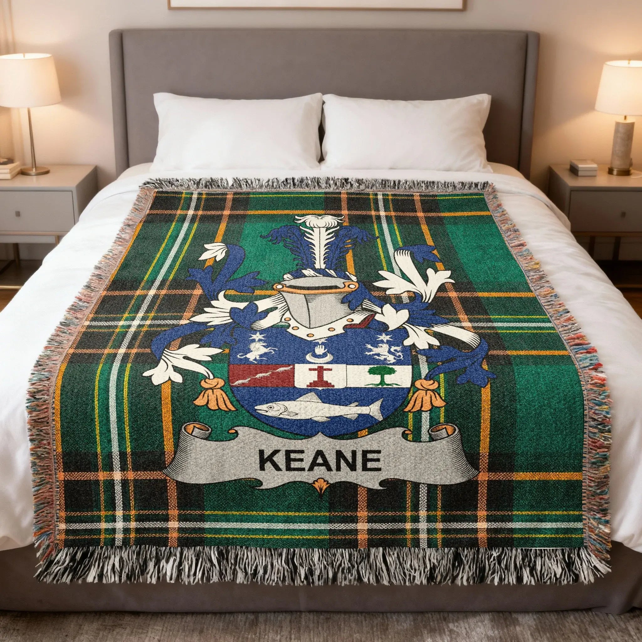 Tartan blanket with Keane family crest centered on a bed.