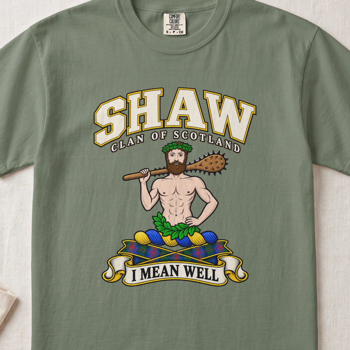 Shaw Scottish clan T-shirt in Moss, front view with a bearded figure carrying a wooden club over one shoulder and motto banner.
