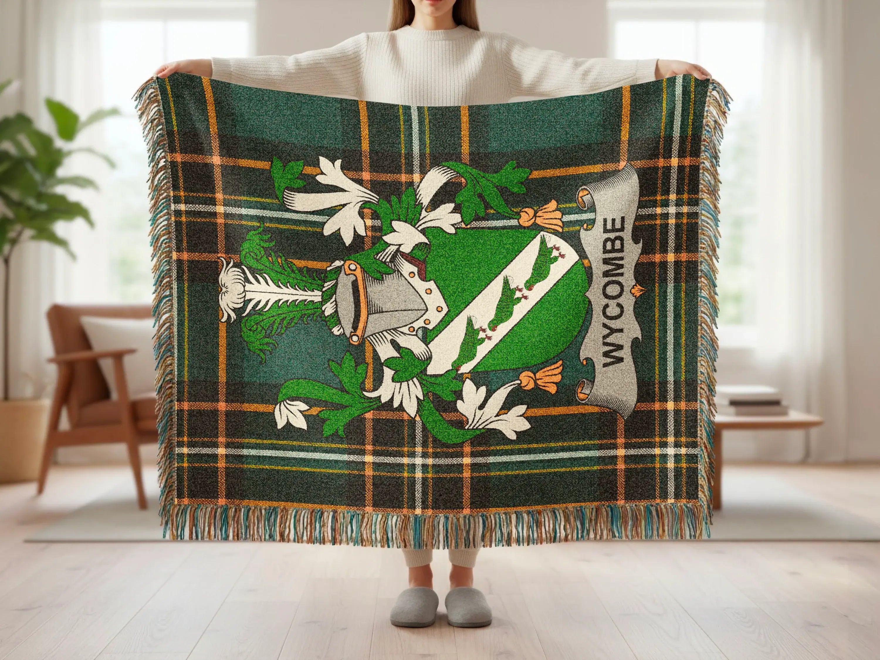 Green tartan throw blanket with a coat of arms and "Wycombe" text.