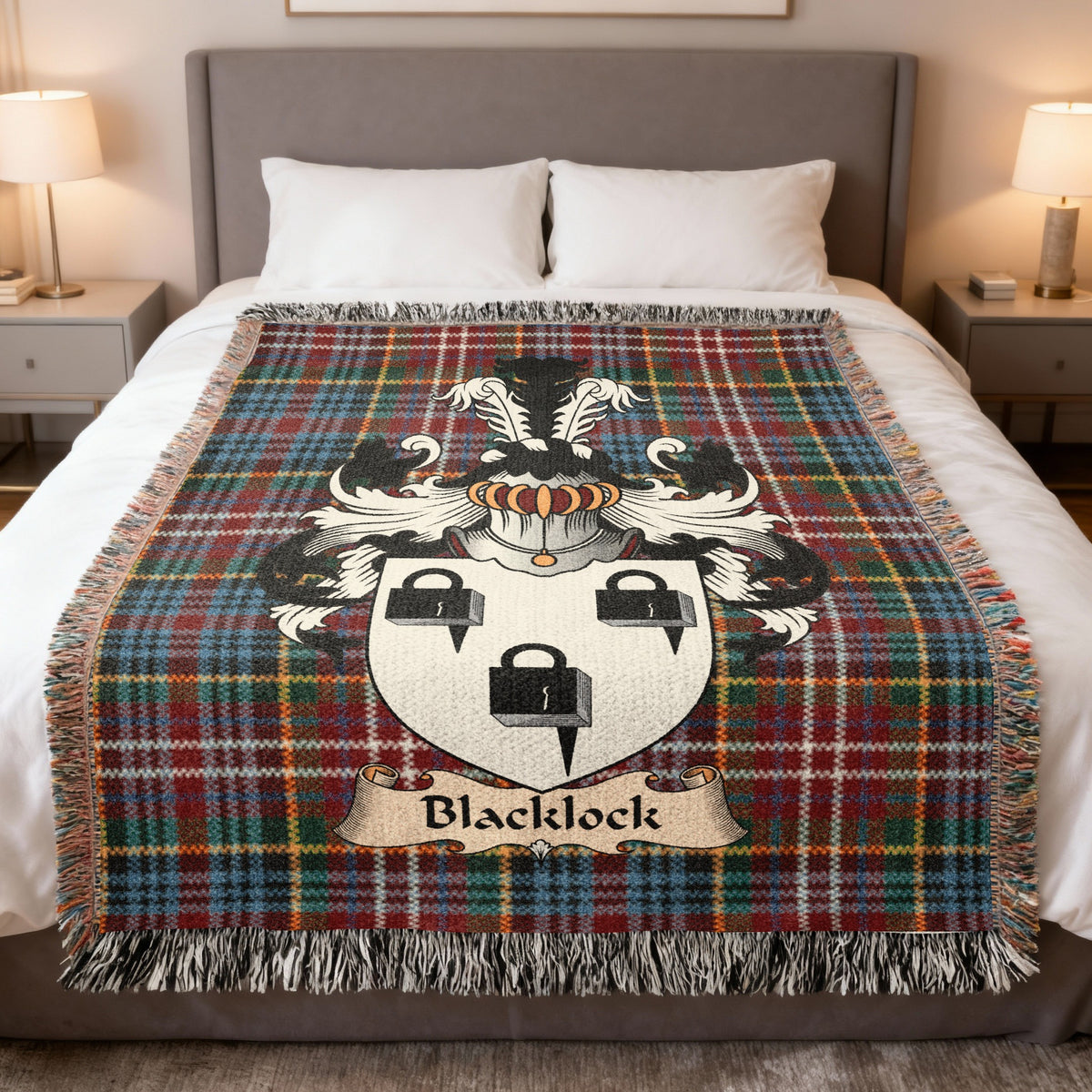 Blacklock family crest emblem on a Caledonia tartan woven blanket