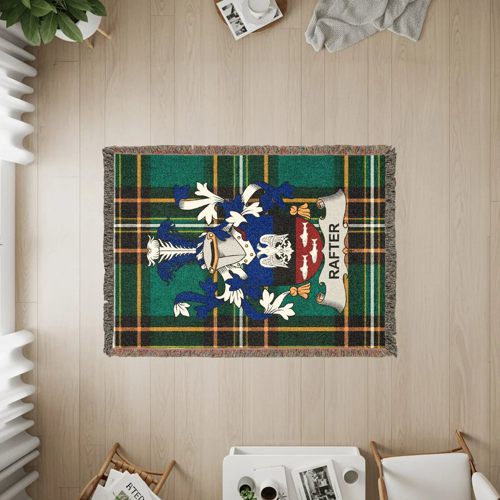 Woven plaid throw blanket with the Rafter family crest.