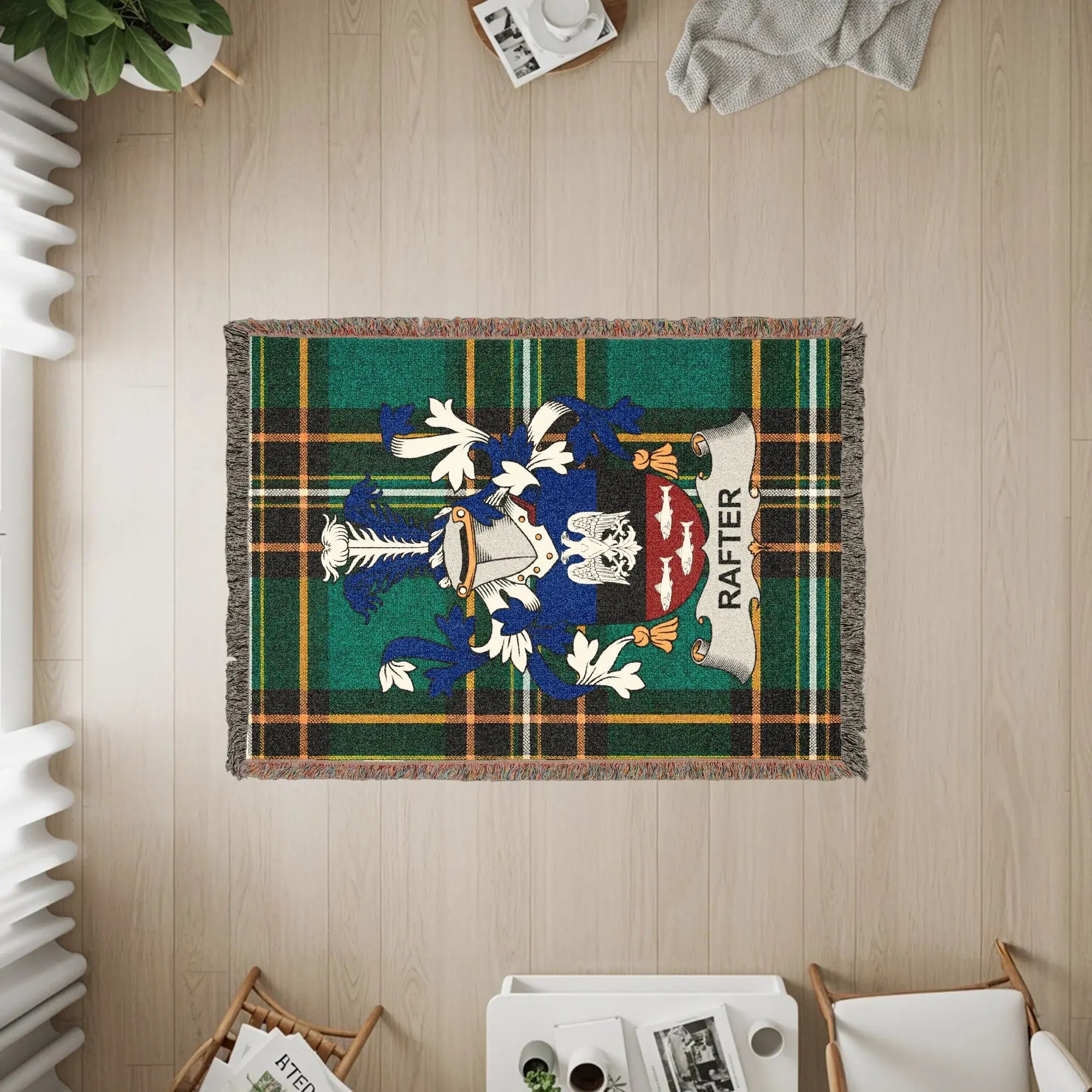 Woven plaid throw blanket with the Rafter family crest.