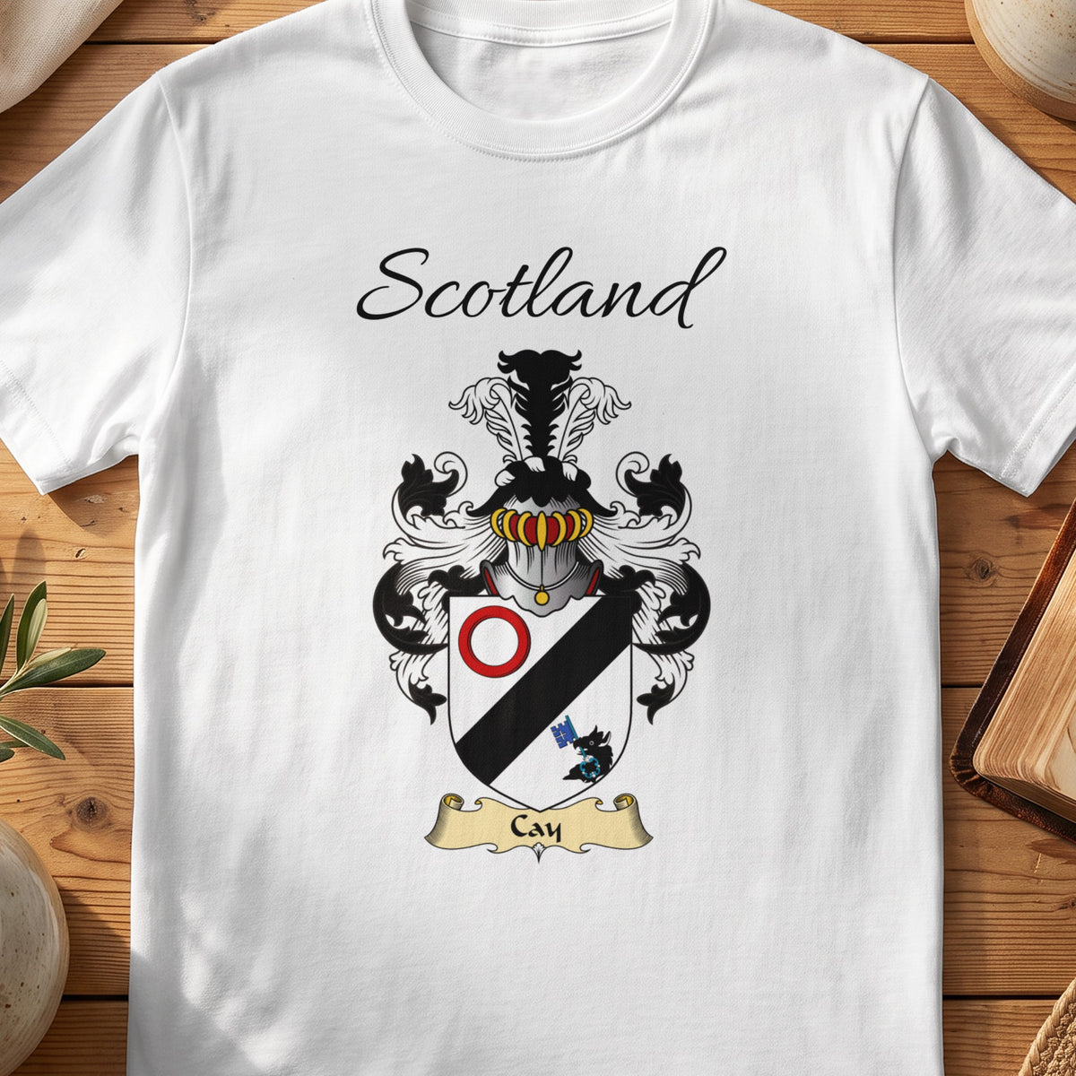 White Cay Scottish family shield T-shirt featuring a black diagonal band with a red ring
