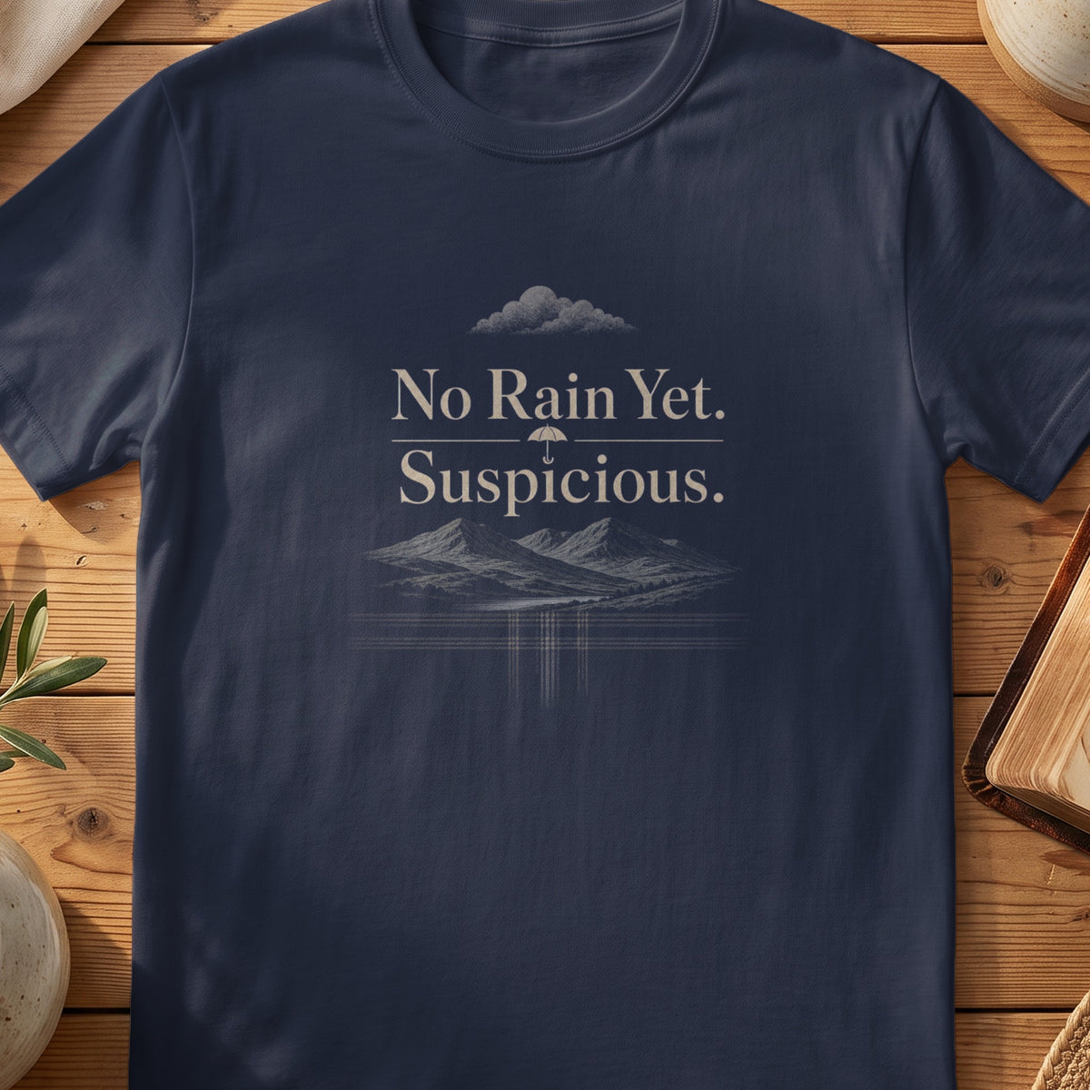 Navy Gildan 64000 unisex T-shirt flatlay with No Rain Yet Suspicious Scottish graphic design