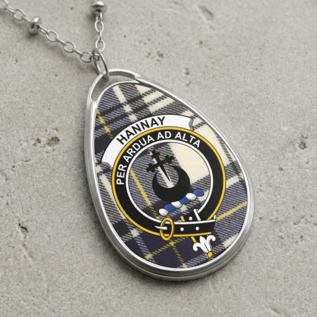 Hannay tartan oval pendant with clan crest and motto "Per Ardua Ad Alta".