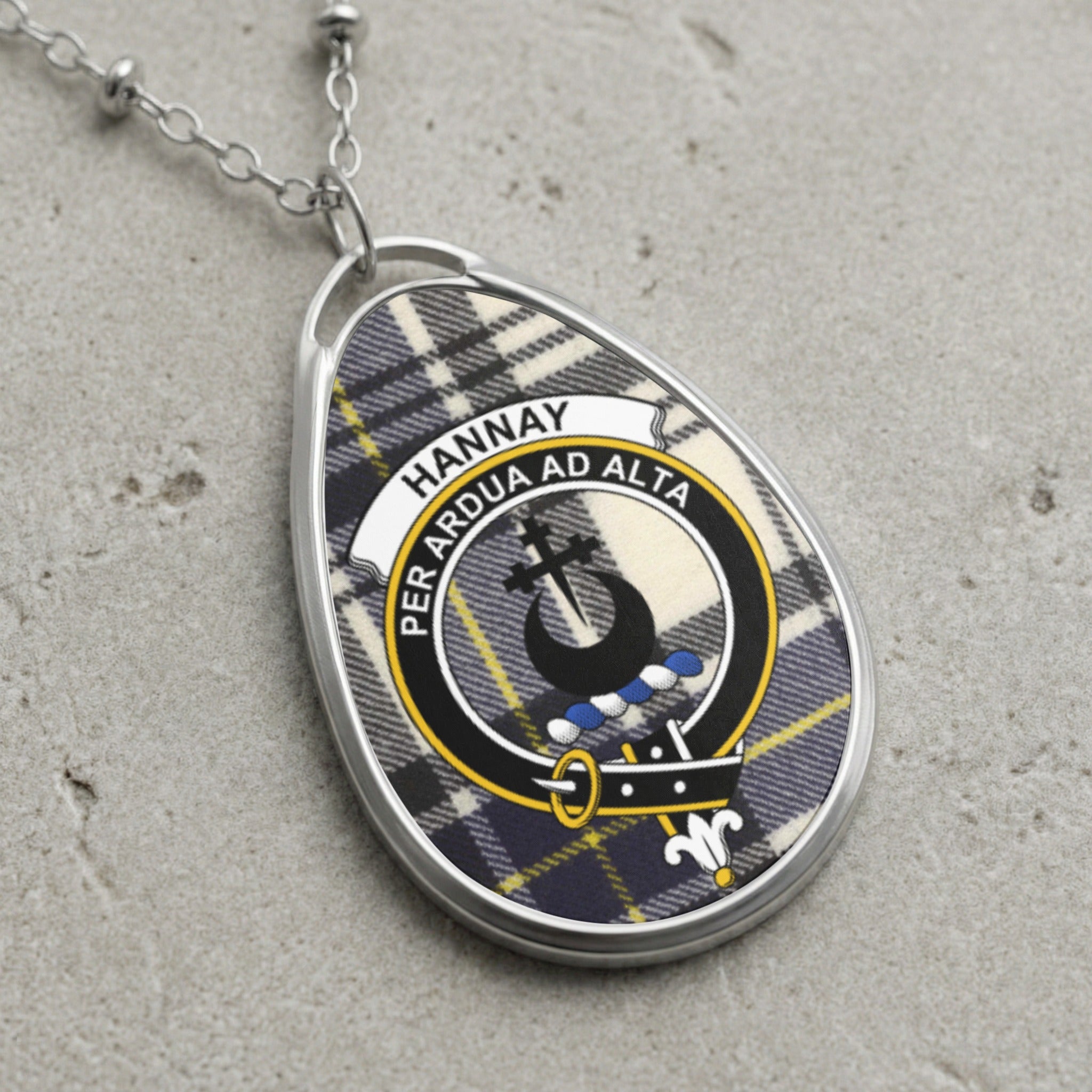 Hannay tartan oval pendant with clan crest and motto "Per Ardua Ad Alta".