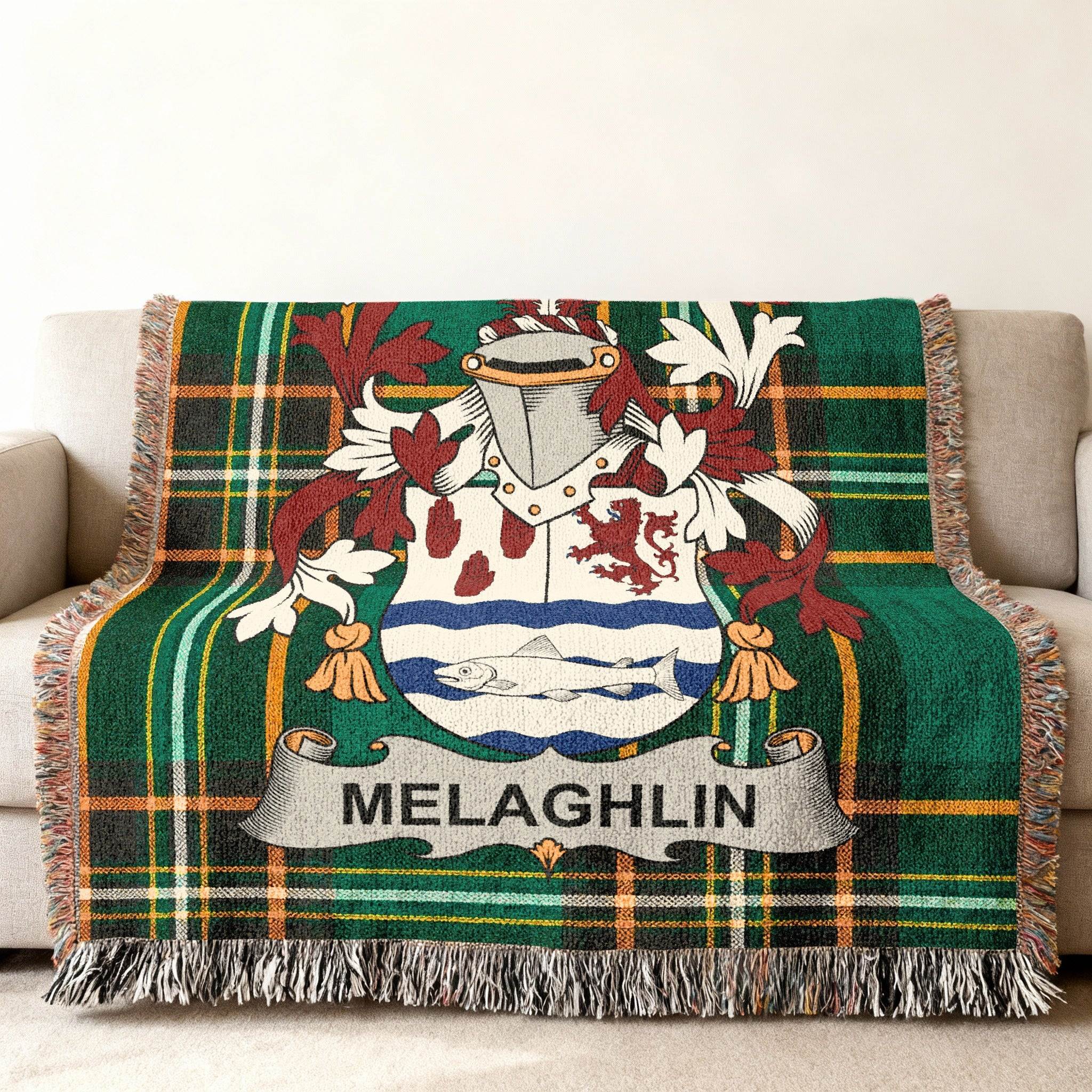 Green plaid throw blanket with Melaglin family crest.
