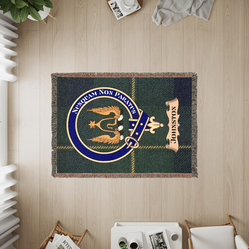 Johnston tartan throw with family crest featuring "NUNQUAM NON PARATUS" and a banner.