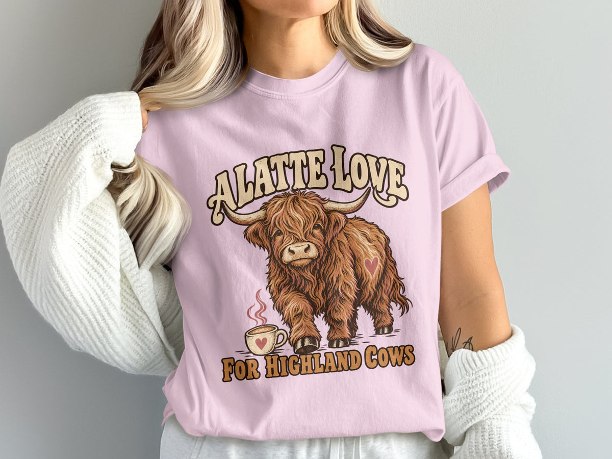 Model wearing the A Latte Love for Highland Cows Highland cow Comfort Colors T-shirt in Blossom